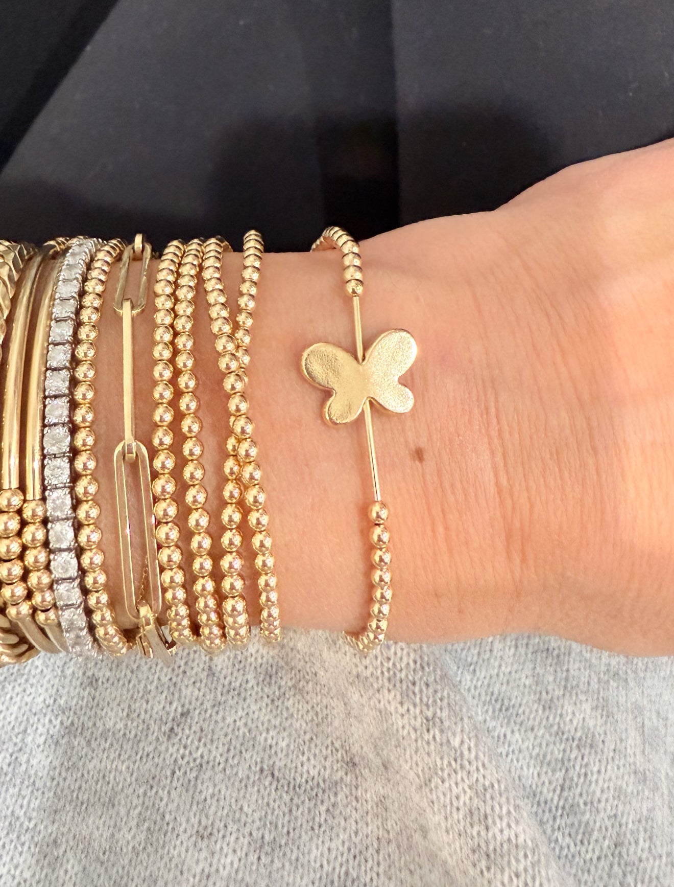 Butterfly on gold filled beaded stretch ball bracelet