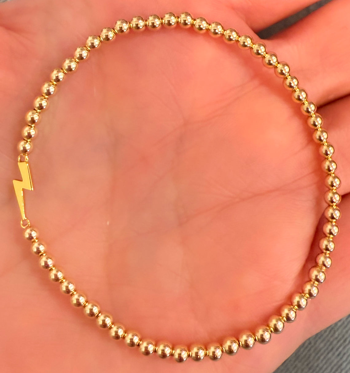 Lightning bolt on gold filled ball stretch bracelet