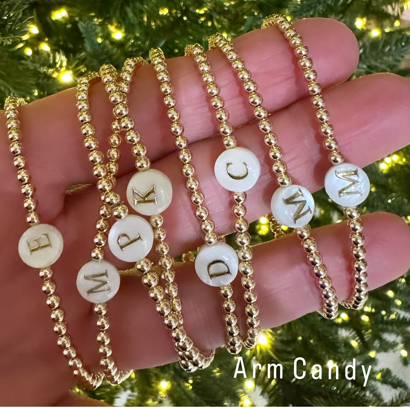 Shell with gold font initial, on gold filled ball, stretch bracelet