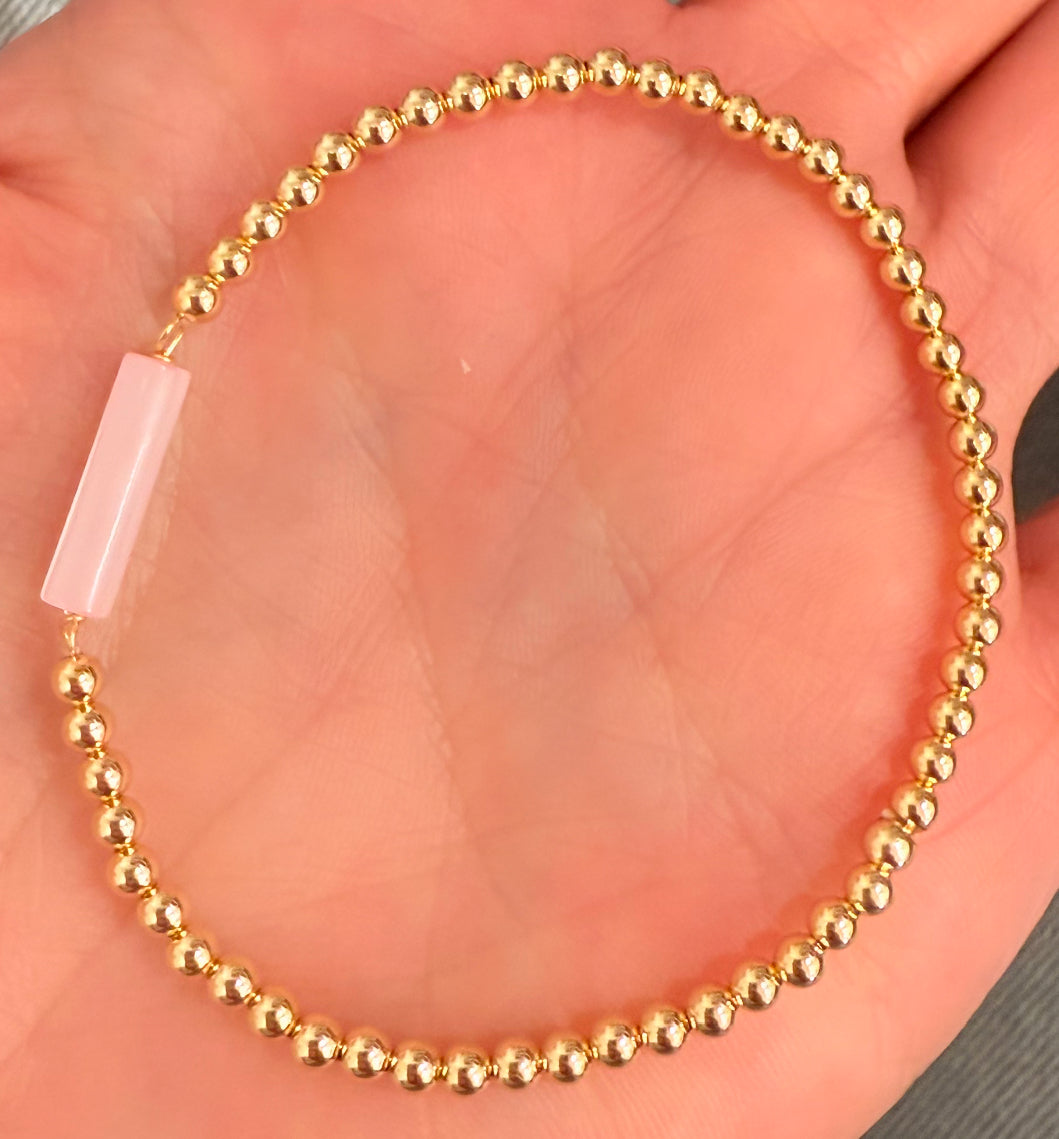 Pink shell bar on 3mm gold filled ball stretch bracelet